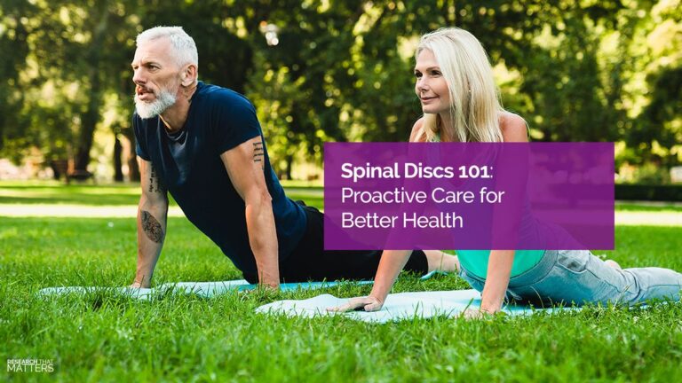 A man and a woman gracefully perform yoga poses on mats in a grassy park. Text overlay reads: "Spinal Discs 101: Embrace Proactive Care for Better Health.
